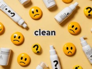 Skincare products and emoji on yellow background