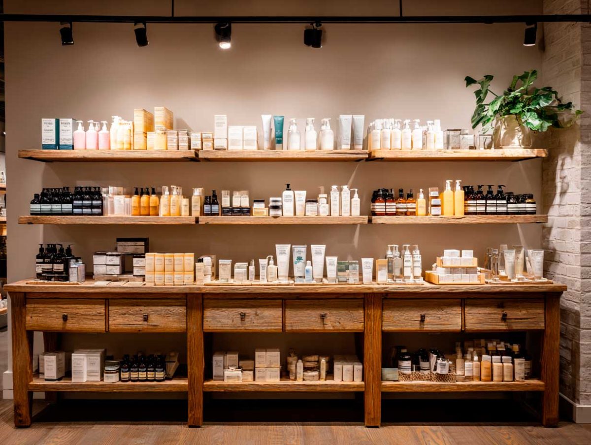 Wooden shelves with assorted skincare products