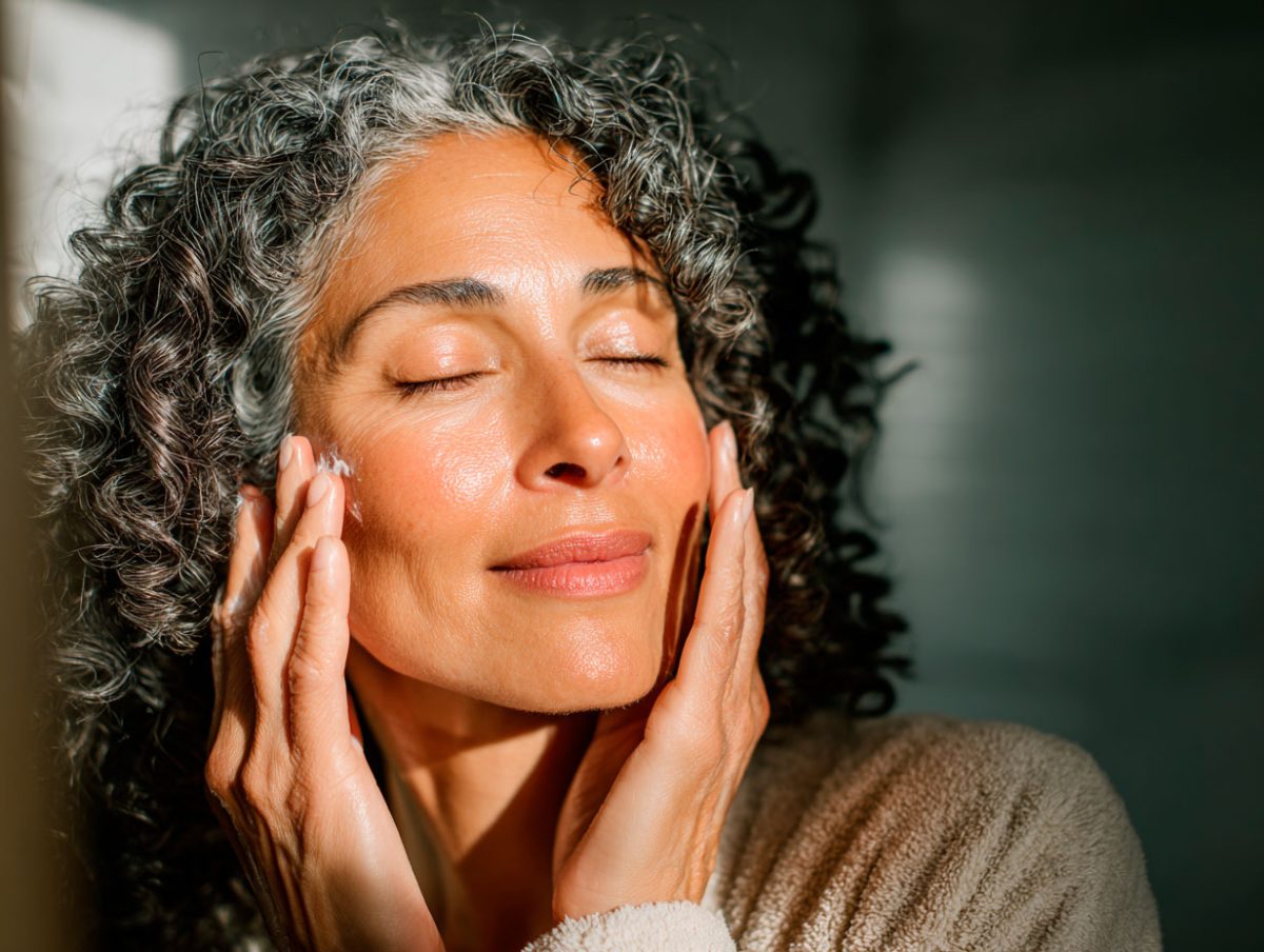 Woman enjoying the sun on her face