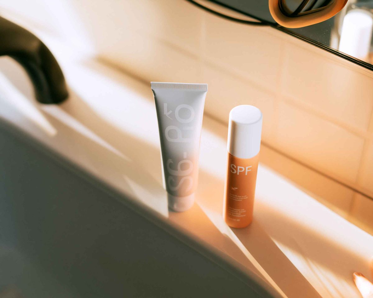 close up of a hand cream tube and a spf bottle f6a5b395 12c1 46b5 a349 c15f56806c03 1