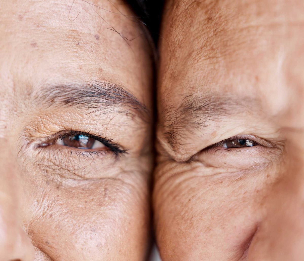 Close-up of an older person's squinting eyes and wrinkles